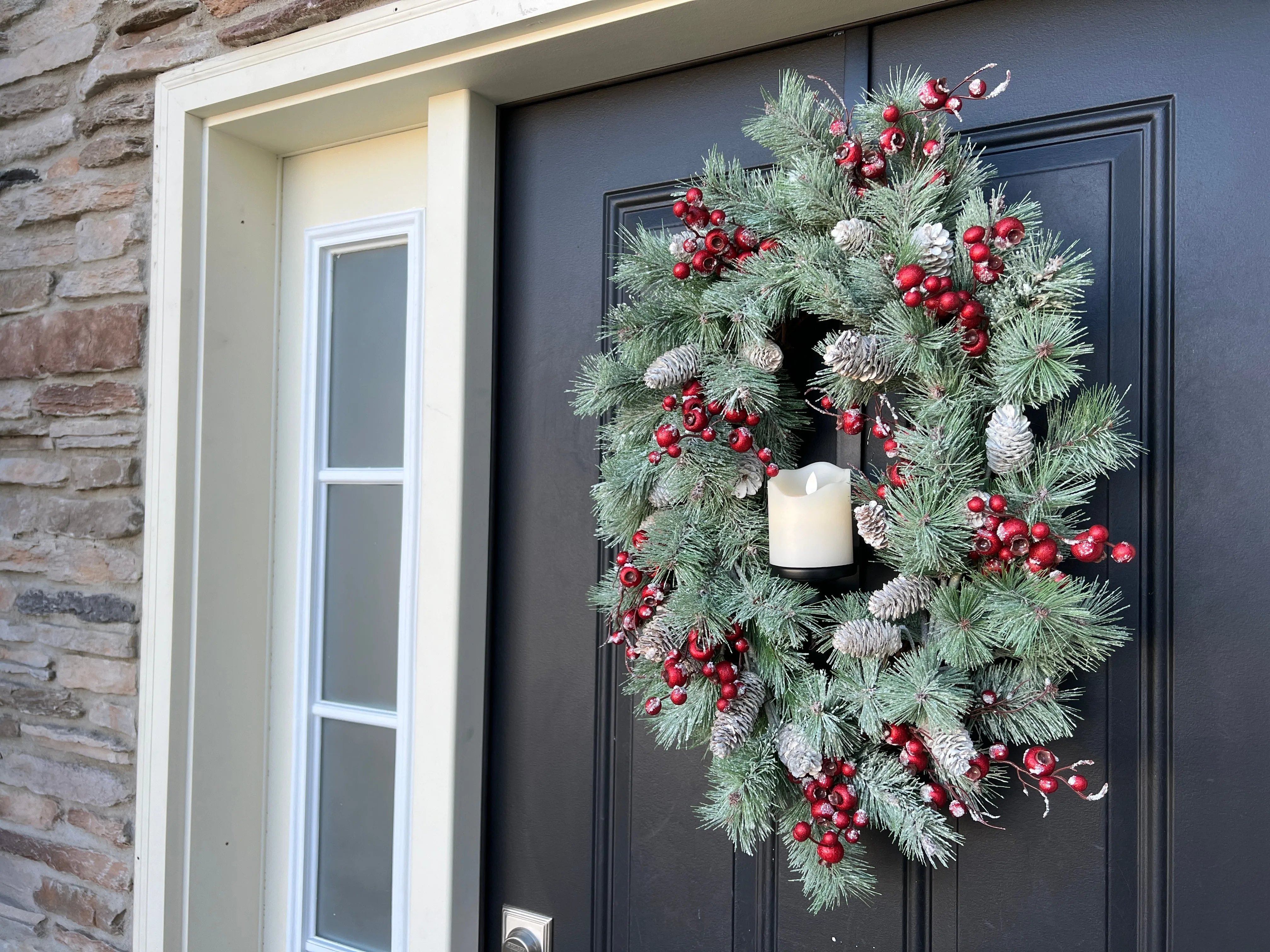Oval Flocked Winter Pine Wreath with Flickering Candle